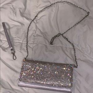 Clutch hand bag with wrist strap